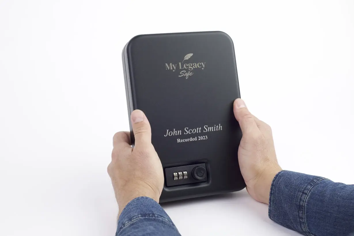 Hands holding the legacy safe